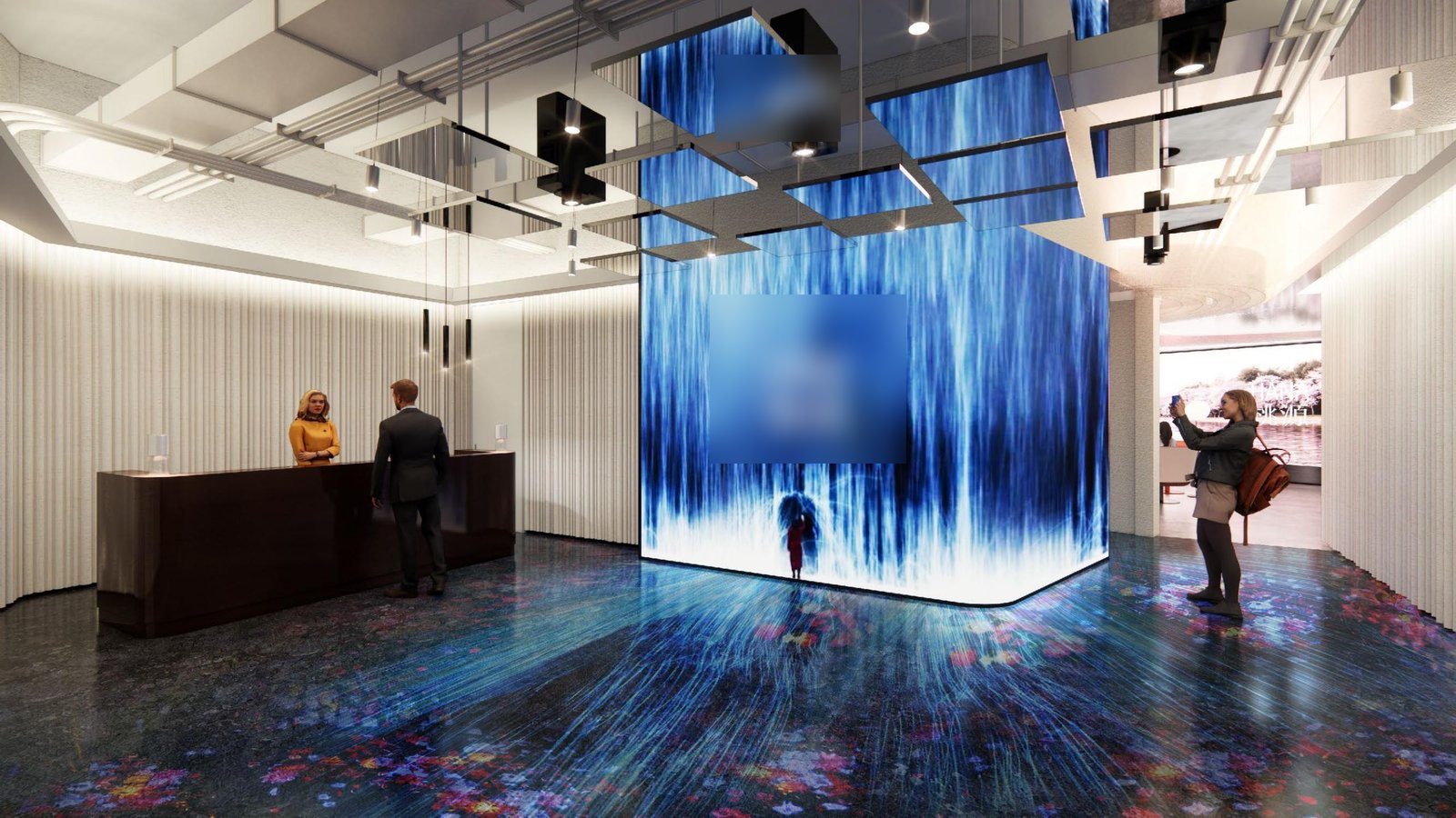 Reception with a backlit blue digital media wall and reception desk
