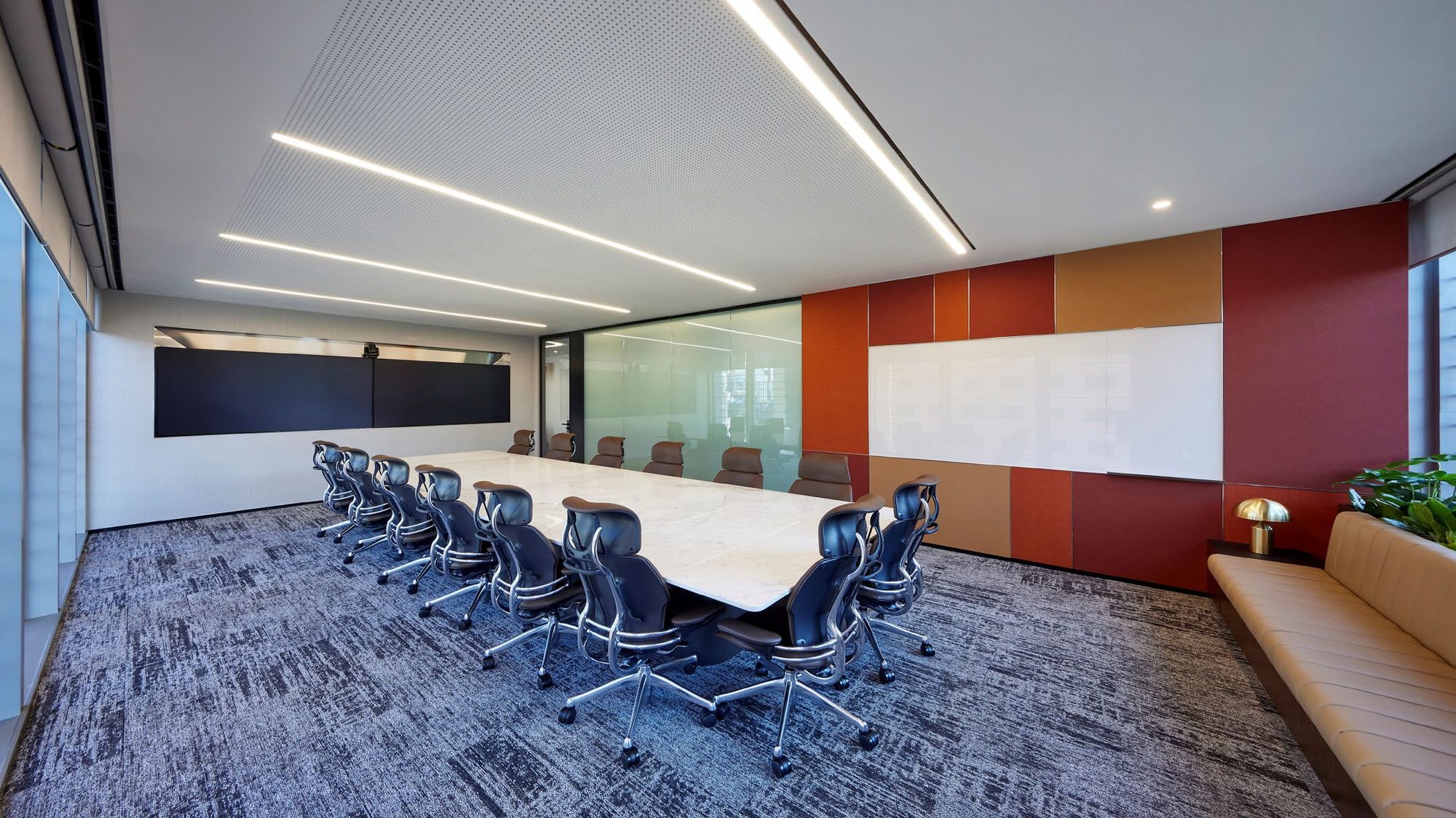 Large conference room with rust accent wall
