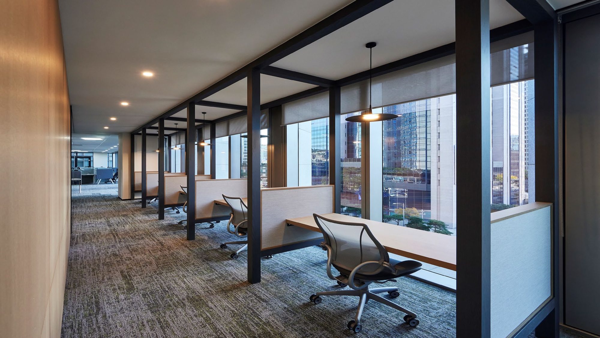 Glass-walled corridor and elevator lobby