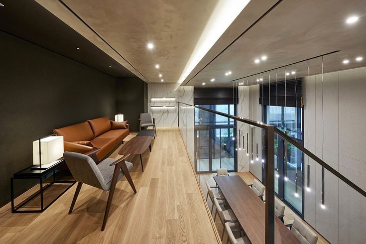 Warm wood corridor connecting executive spaces