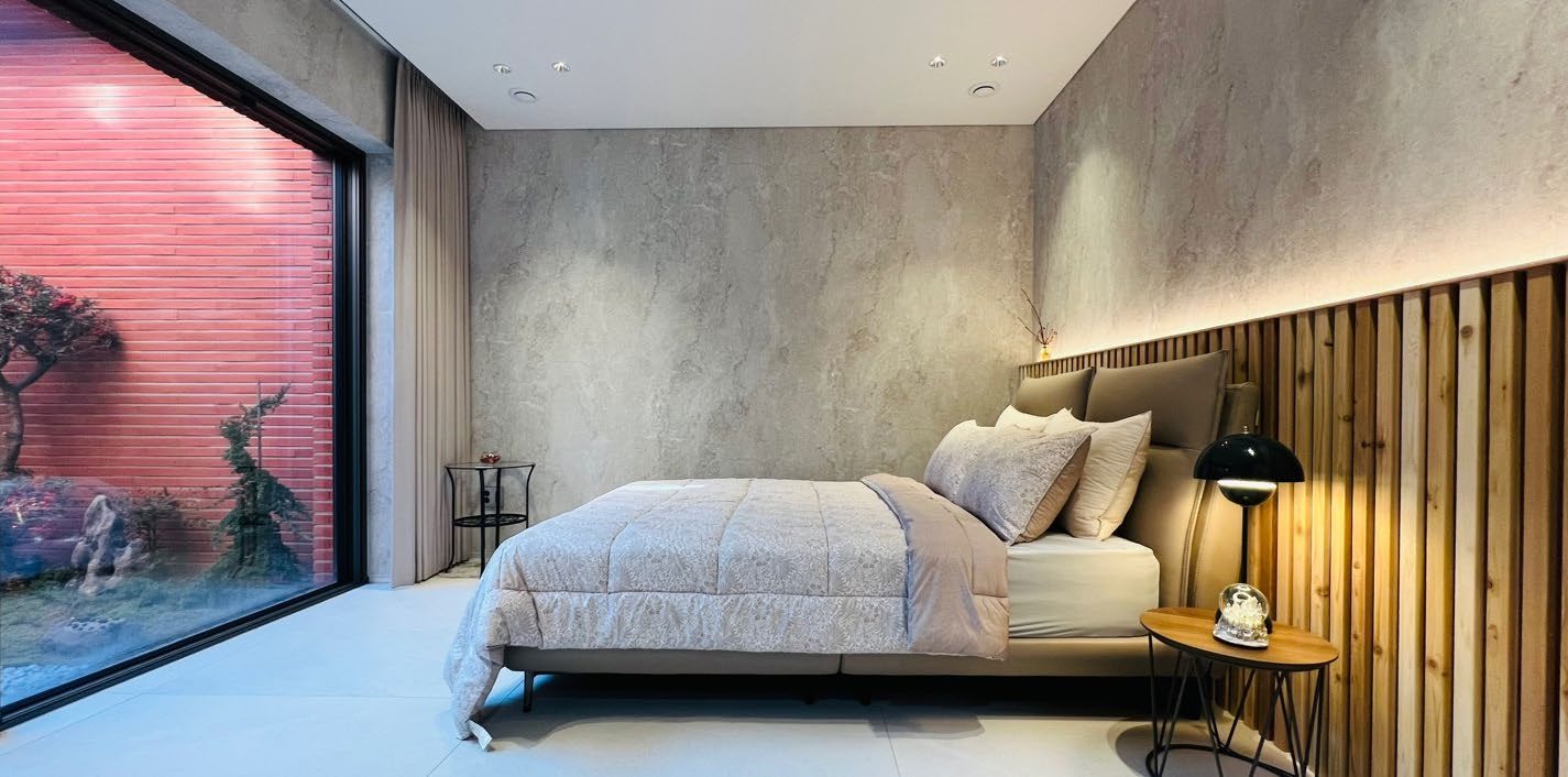 Bedroom with warm wood headboard