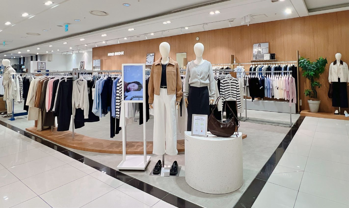 Wide view of store floor with wood fixtures