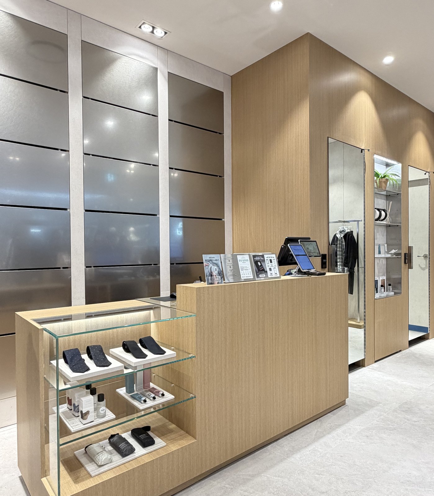 Checkout counter and fitting room area with product display case